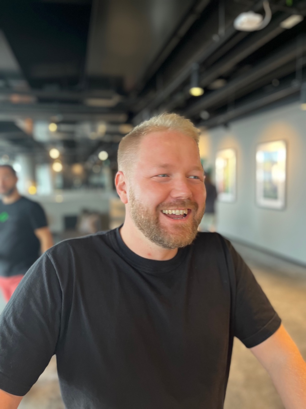 Jonas Wärngård portrait 2 — smiling in a black t-shirt